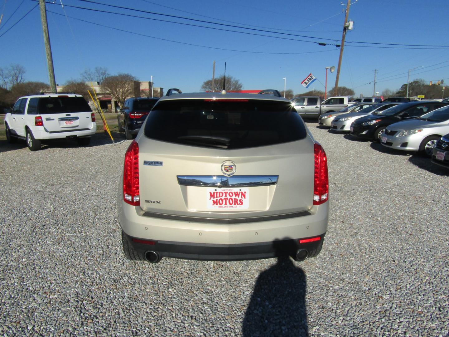 2012 Gold Cadillac SRX Premium (3GYFNCE36CS) with an 3.6L V6 DOHC 24V FFV engine, Automatic transmission, located at 15016 S Hwy 231, Midland City, AL, 36350, (334) 983-3001, 31.306210, -85.495277 - Photo#6